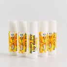 5 honey lip balms standing vertical