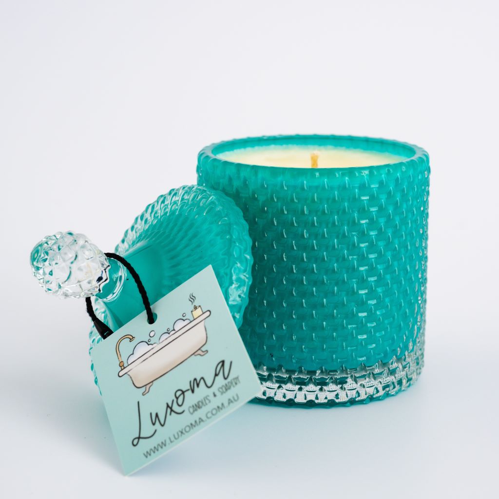 Teal tear drop candle on white background